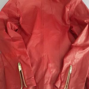 Leather, red zippered jacket and matching skirt